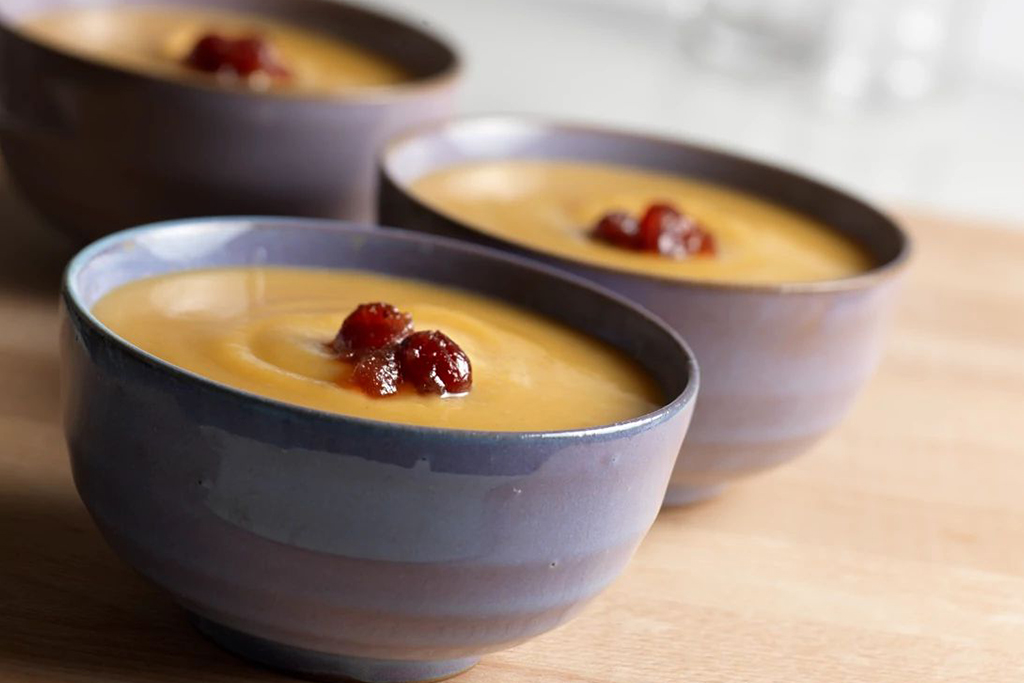 Cream of Pumpkin Soup with Cranberry Drizzle
